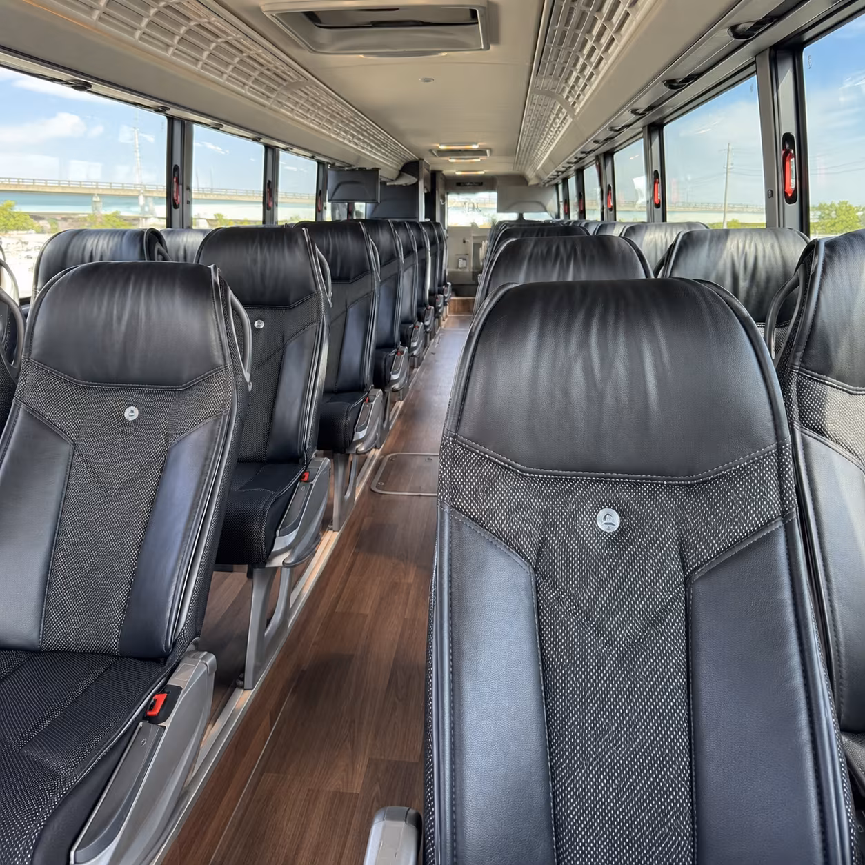 how one way transfers round trips and multi day bookings are priced for bus rentals in newark